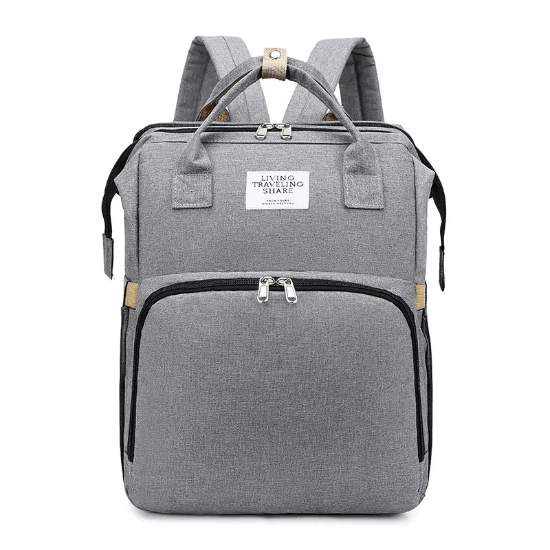Gray backpack with visible brand label on a white background